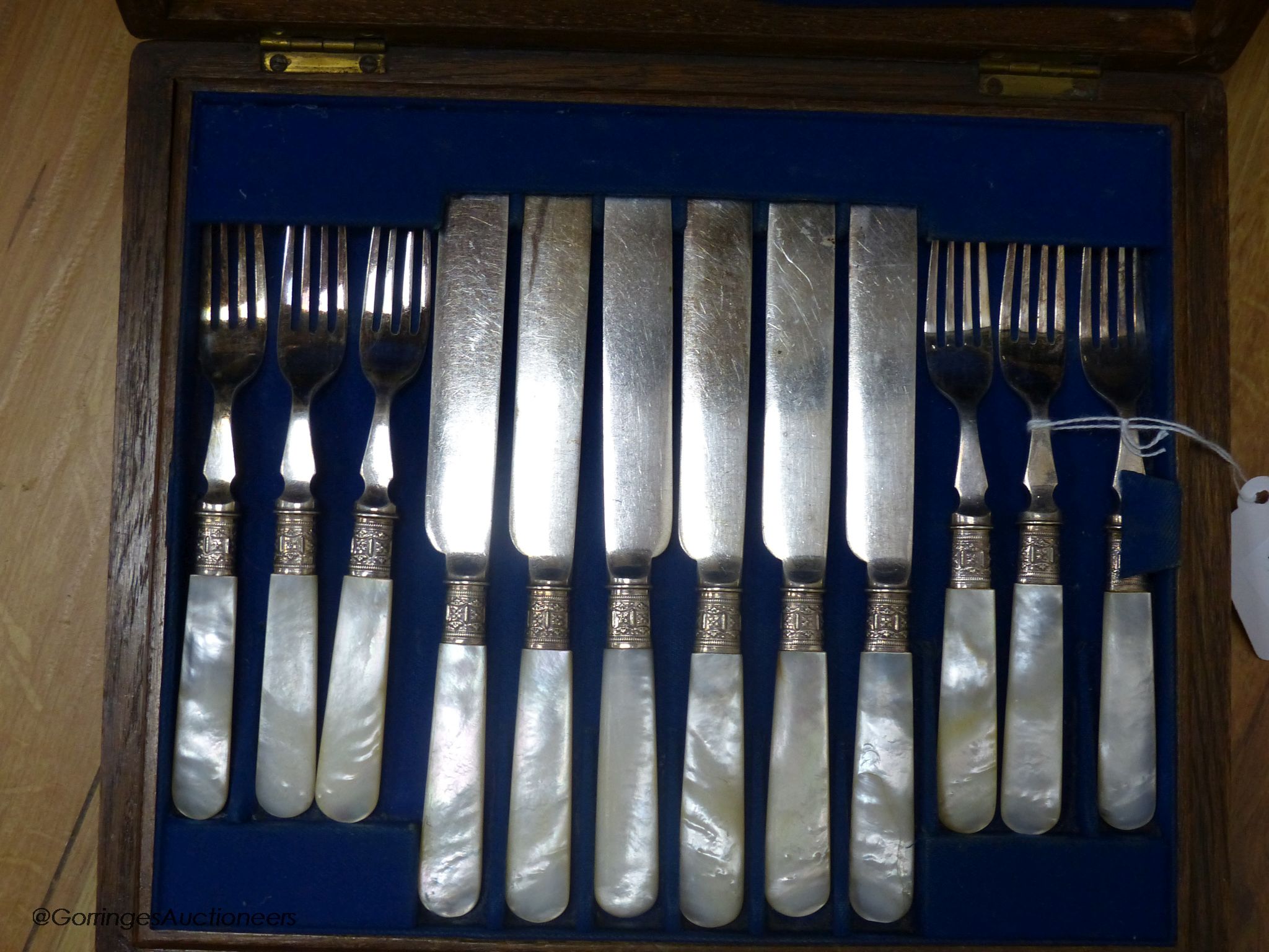 A cased part set of condiments and a cased set of plated fish knives and forks